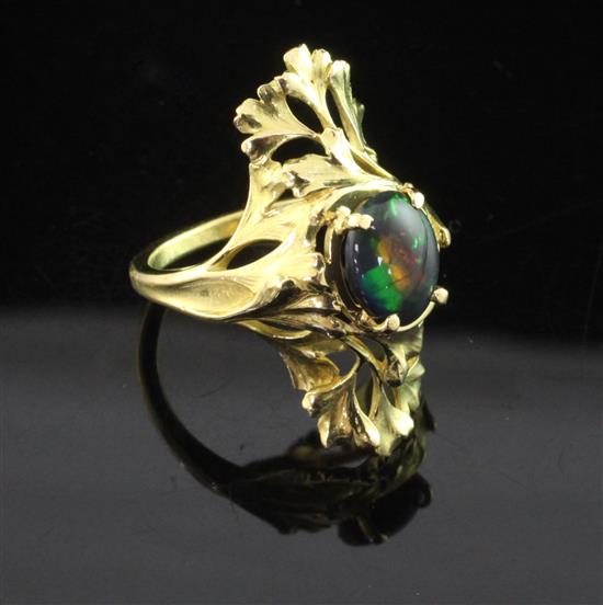 A French 18ct gold and black opal up-finger ring, size N.